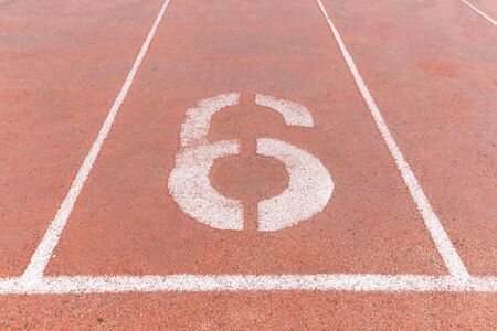 Start track. Lanes 6, number six of a red racing track.の写真素材