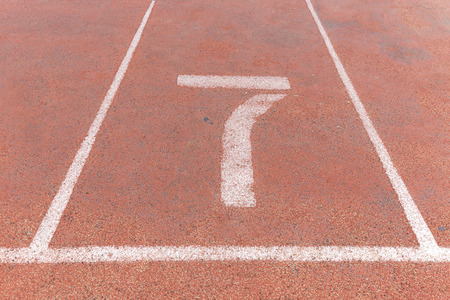 Start track. Lanes 7, number seven of a red racing track.の写真素材
