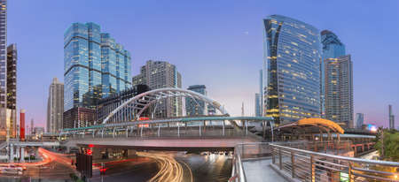 Modern building at night. Traffic in the business district The Skytrain station Chong Nonsiの写真素材
