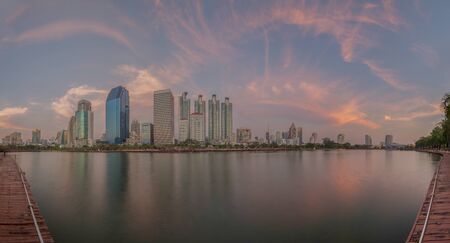 Benchakitti Public Park at twilight, Bangkok, Thailand This is a park in honor of Her Majesty Queen Sirikit. Near the skyscraper business district.の写真素材