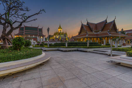Wat Ratchanatdaram a Beautiful temple at twilight time, the temple is best known for the Loha Prasat famous landmark for tourist in Bangkok,Thailandの写真素材