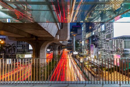 Pathumwan intersection, Busy main street with traffic light trails at twilight in bangkok, thailandの写真素材