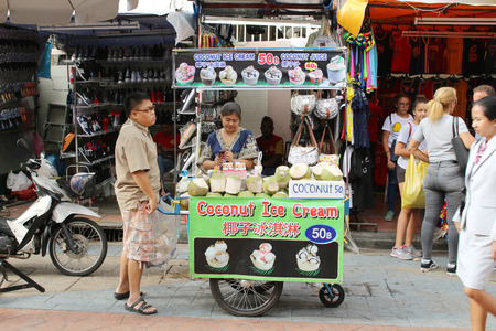 Bangkok, Thailand - April 30 , 2018 : Yong women sell  Coconut Ice Cream near Khao San Road, Khao San road is a famous place for sight-seeing and eating in Bangkok.のeditorial素材