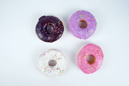 Colorful chocolate donuts Isolated on white background.                               の写真素材