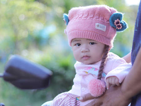 Portrait of a baby sitting on a motorcycle.のeditorial素材