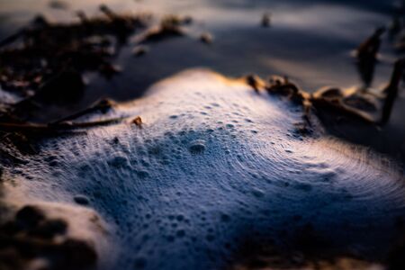 close up Waves breaking through freshwater swamps causing banks to flood.