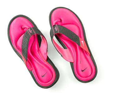 Buriram, Thailand, January 24, 2021. Nike comfort footbed sandals, pink that have been used.のeditorial素材