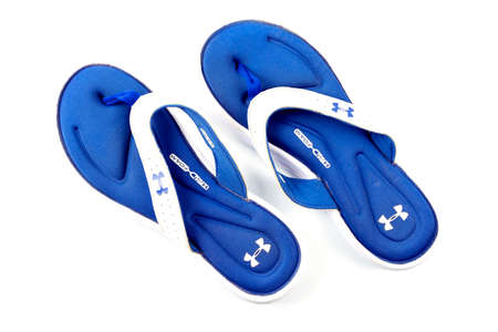 Buriram, Thailand, January 24, 2654, branded sandals, under armor shoes, second hand, through use, there are traces of use. Isolated on white backgroundのeditorial素材