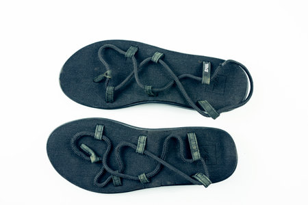 Buriram, Thailand, January 24, 2654, Teva  sandals, second-hand, through use, there are signs of use. Isolated on white backgroundのeditorial素材