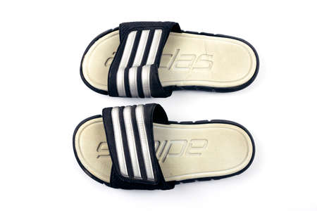Buriram, Thailand, January 24, 2654, adidas  sandals, second-hand, through use, there are signs of use. Isolated on white backgroundのeditorial素材