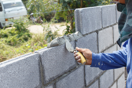 Workers build a wallの写真素材