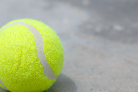 Tennis ball on the ground