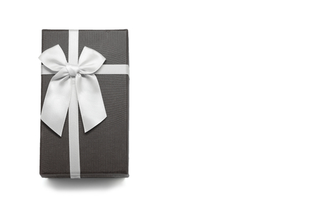 Gift box with white ribbon bow, isolated on whiteの写真素材