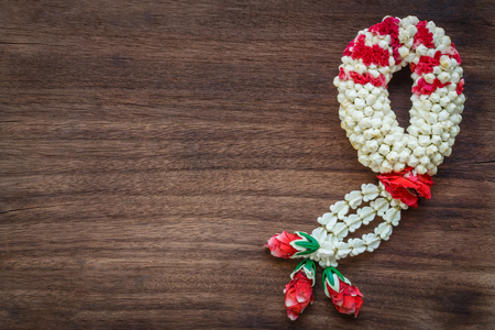 nice jasmine garland on wood backgroundの写真素材