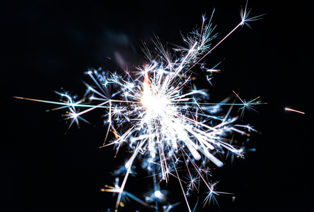 Burning sparkler isolated on black backgroundの写真素材