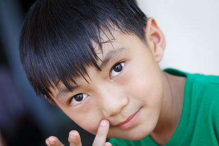 Child looking intentlyの写真素材