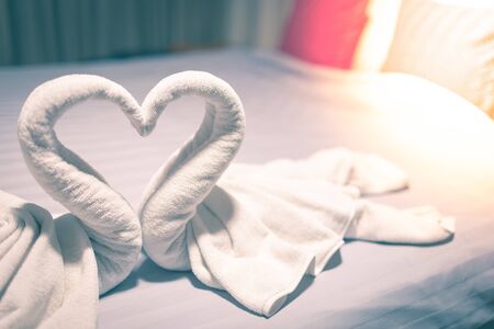 Towel is made of a white swan in the bed detail art blurの写真素材