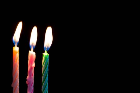 Three birthday candles on black background detail artの写真素材