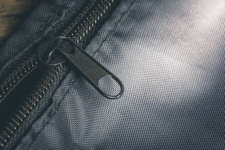 Closeup zipper on a black bag detail objectの写真素材