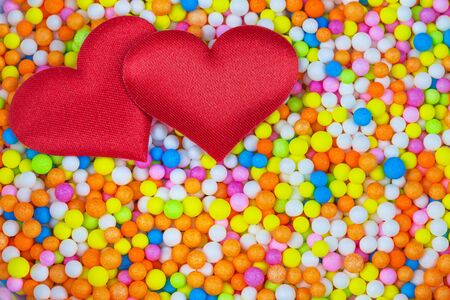 Red heart with multicolored foam beads detail artの写真素材