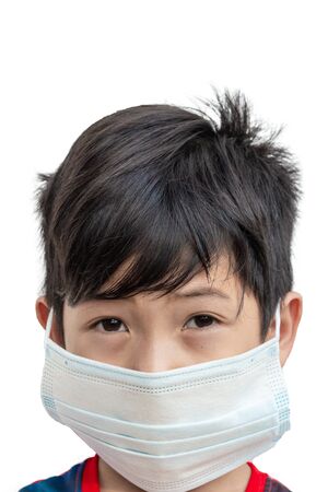 Asia boy wear masks to protect against diseases and virus COVID-19 or Coronavirus treatment concept isolated on a white backgroundの写真素材
