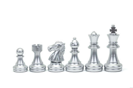 Silver chess piece stand in a row isolated on white background (king, queen, bishop, knight, rook, pawn). Clipping pathの写真素材