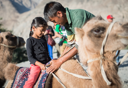 Leh Ladakh , India - August 9:The little girl was riding a camel 9, 2015のeditorial素材