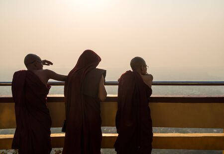 Three Monks at Mandalay hill, Mandalay, Myanmar