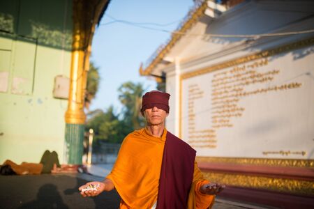 Yangon, Myanmar -  February 23: Unidentified Monk Praying in Yangon, Myanmar 23, 2017のeditorial素材