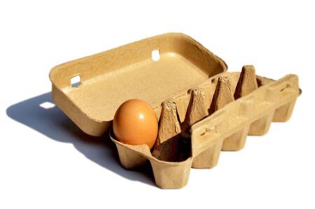 An egg in the package and isolate on the white background.の写真素材