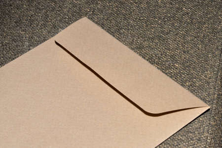 Close up envelope on burlap texture.の写真素材