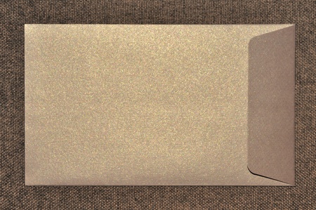 Close up envelope on burlap texture.