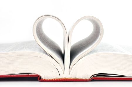 Close up heart of book pages isolated on white background.の写真素材