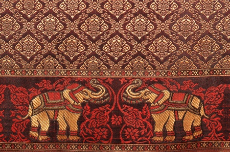 Elephant pattern background and thai painting pattern of thai silk.の写真素材