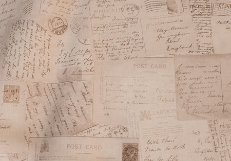 Scattered postcard with hand writing from other countryの写真素材