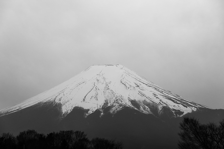 A picture of Mt. Fiji or Fujiyama. A Famous landmark of Japan in a cloudy day.の写真素材