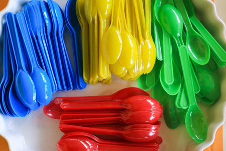 Colorful plastic spoon backgroundの写真素材
