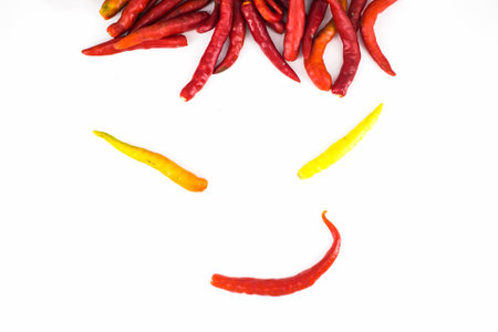 Funny smile face with hot red chiliの写真素材