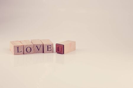 Stamping blocks alphabet  with the word LOVE YOU  spelled vintage styleの写真素材