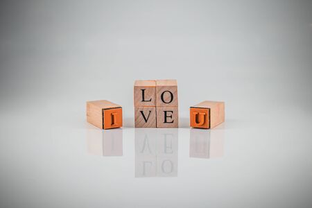 Stamping blocks alphabet  with the word I LOVE YOU  spelled vintage style spelledの写真素材