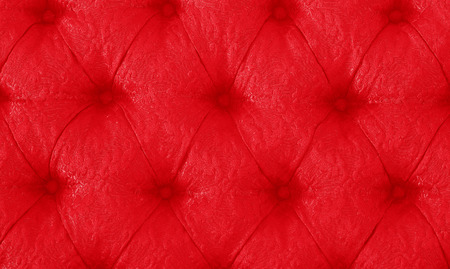 Vintage red sofa button for textured background.の写真素材