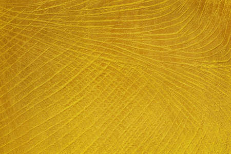golden cement texture background, golden decorative plaster wall.の写真素材