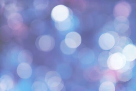blue bokeh lights background, colorful glitter defocused.
