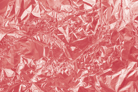 Rose Gold foil shiny texture, abstract red wrapping paper for background and design art work.の写真素材