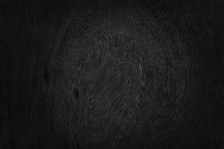 Black wooden wall background, texture of dark bark wood with old natural pattern for design art work, top view of grain timber.の写真素材