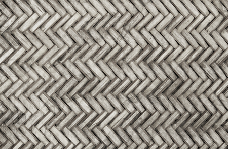 Old bamboo weaving pattern, woven rattan mat texture for background and design art work.
