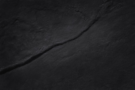Dark grey black slate texture in natural pattern with high resolution for background and design art work. Black stone wall.の写真素材