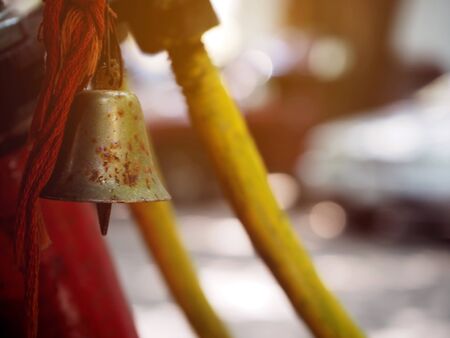 Closeup of small old bell with selective focus.の写真素材
