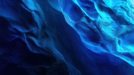 Stunning abstract image featuring soft blue wave patterns and fabric textures. The interplay of light and shadow creates a dreamy, serene atmosphere perfect for artistic projects.の素材