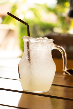 Soda with ice and slice of lemonの写真素材